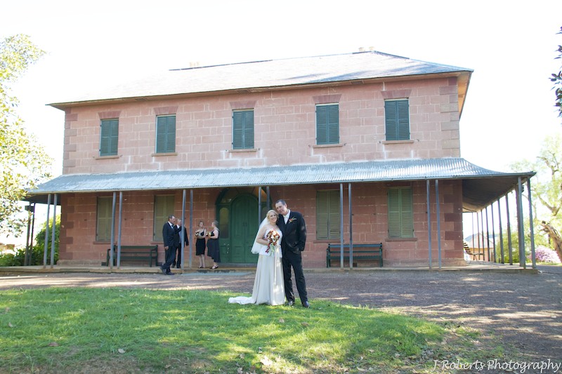 Bride and groom outside Rouse Hill House - wedding photography sydney